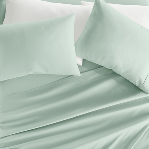 Light green double-brushed sheet set with a smooth, soft texture, including pillowcases, fitted sheet, and flat sheet.