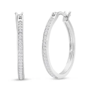 A pair of thin, silver hoop earrings encrusted with small diamonds, featuring a sleek and elegant design.