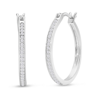 A pair of thin, silver hoop earrings encrusted with small diamonds, featuring a sleek and elegant design.