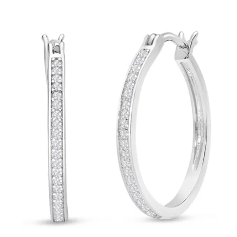 A pair of thin, silver hoop earrings encrusted with small diamonds, featuring a sleek and elegant design.