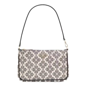A handbag featuring a clover pattern on a light background with a detachable black shoulder strap and a gold-tone logo on the front.