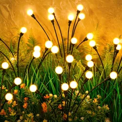 A cluster of solar-powered lights designed to resemble fireflies, with glowing orbs on thin, flexible stakes meant to be placed among garden plants.