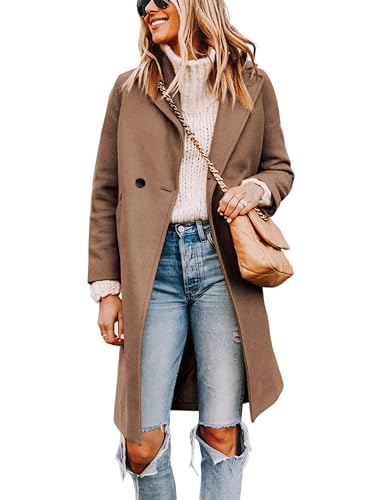 A woman wears a brown knee-length coat over a white knit sweater with ripped blue jeans, accessorized with a beige quilted handbag and sunglasses.