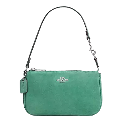 Green suede handbag with a detachable short strap, featuring a silver-tone brand logo and a matching tag.