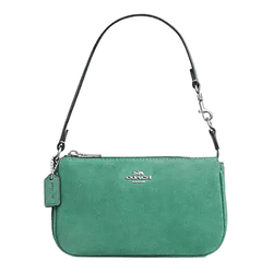 Green suede handbag with a detachable short strap, featuring a silver-tone brand logo and a matching tag.