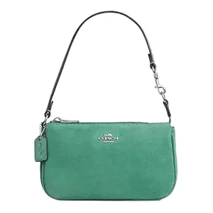Green suede handbag with a detachable short strap, featuring a silver-tone brand logo and a matching tag.