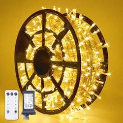 A spool of warm white LED Christmas lights accompanied by a remote control, designed for indoor or outdoor use.