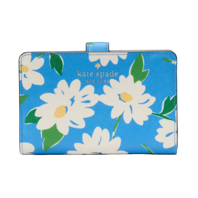 The Kate Spade Schuyler Wallet features a blue background with a daisy floral pattern and gold logo lettering. It has green leaves and yellow accents.