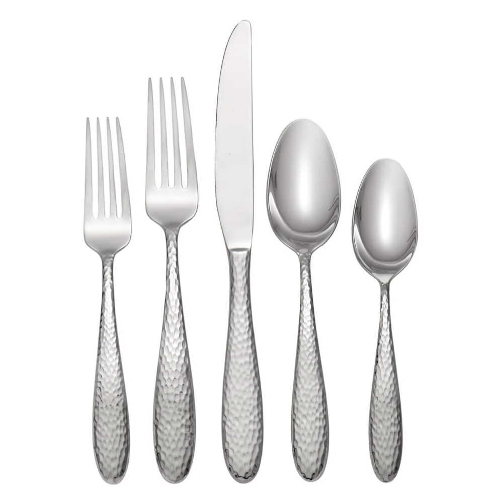 A hammered stainless steel flatware set consisting of a dinner fork, salad fork, knife, tablespoon, and teaspoon.