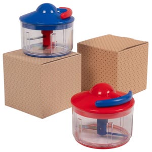 Two manual food choppers with clear containers and colorful lids—one blue, one red—featuring pull-cord mechanisms. They are positioned on patterned boxes.