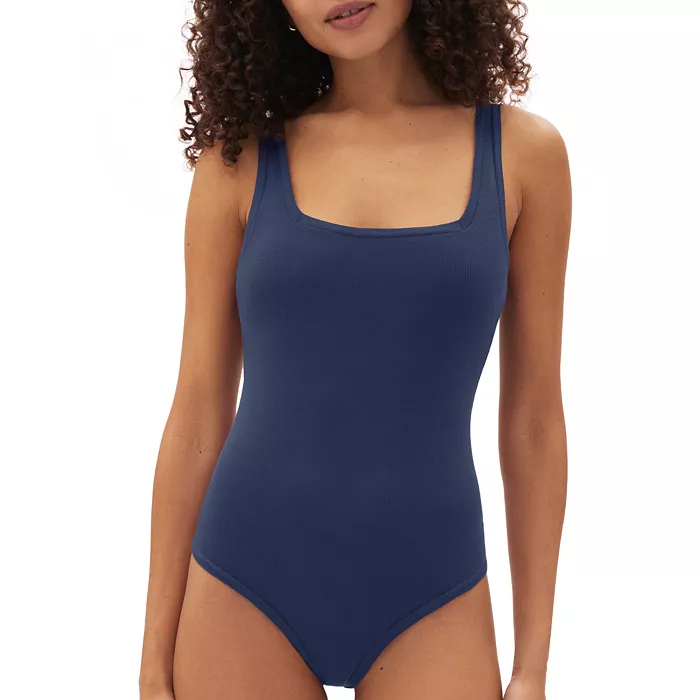 A navy blue thong bodysuit with a square neckline and wide shoulder straps, offering a sleek, seamless look.