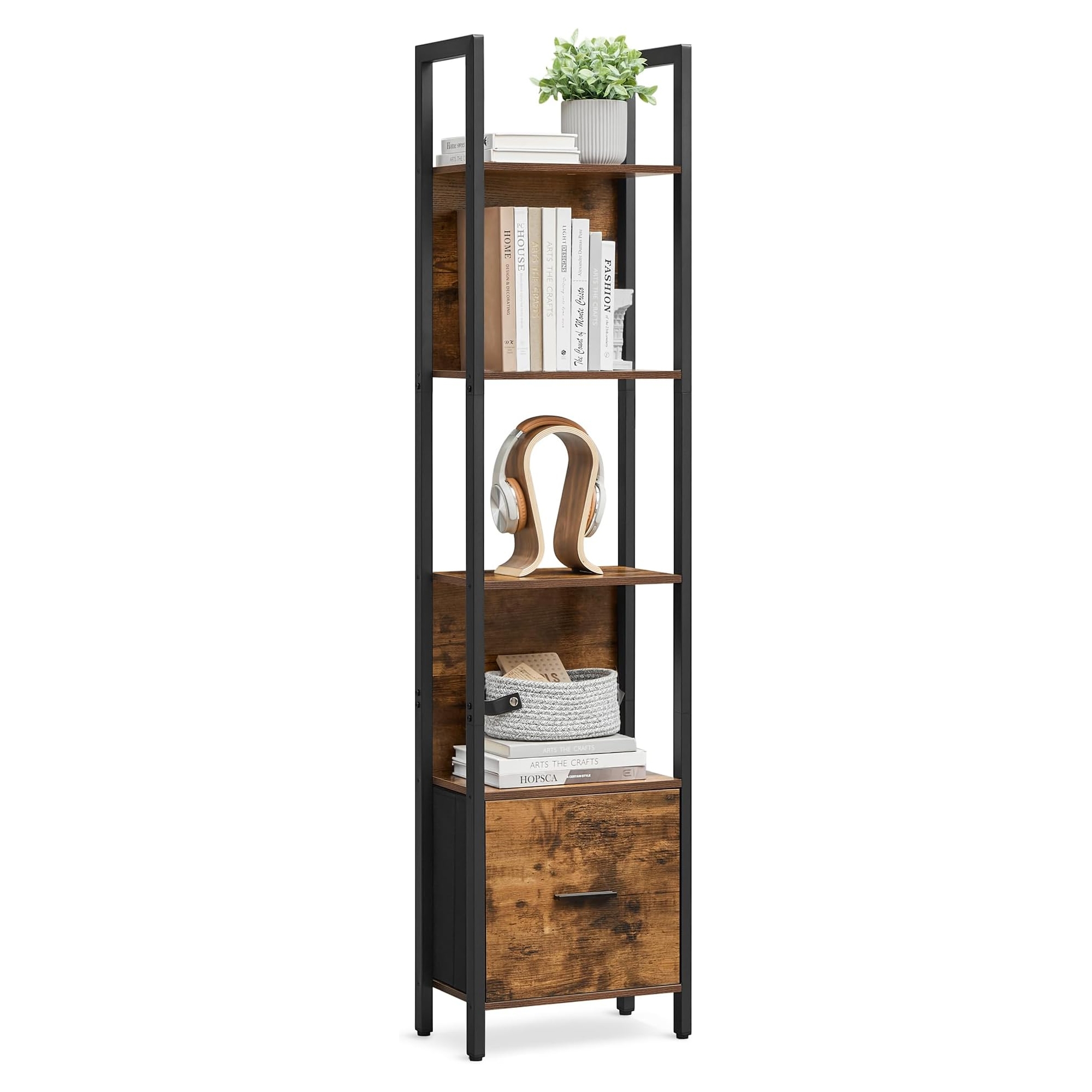 Tall, narrow bookshelf with a black metal frame and wooden shelves, featuring books, a plant, and a decorative headphone stand. Includes a lower cabinet with a drawer for additional storage.