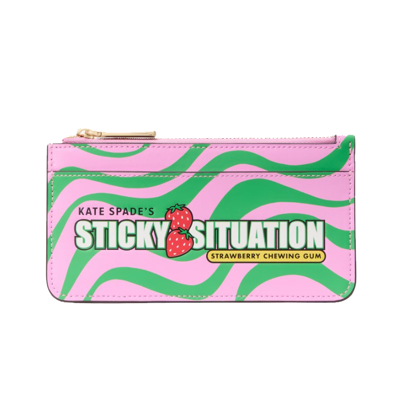 A pink and green zippered wallet by Kate Spade designed to resemble strawberry chewing gum packaging with \“Sticky Situation\“ branding and strawberry graphics.