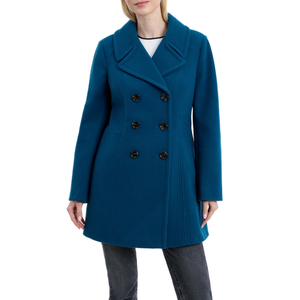 A teal double-breasted coat with a wide collar and six buttons, worn over jeans.