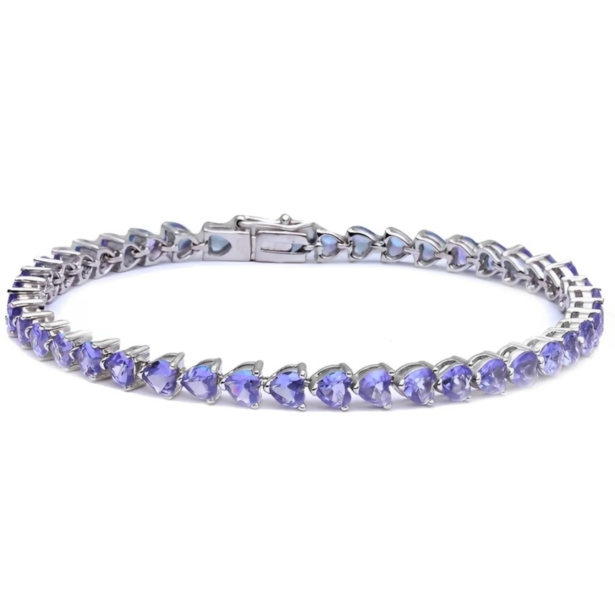 A silver tennis bracelet featuring heart-shaped lavender gemstones arranged in a continuous line with a secure clasp.