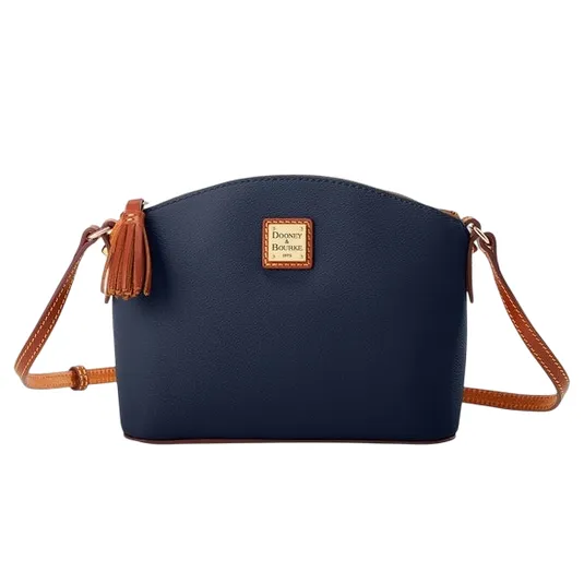 A navy crossbody bag with a tan adjustable strap and tassel, featuring a gold-tone brand logo on the front.