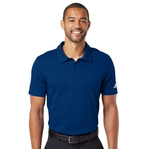 A man wearing a blue Adidas polo shirt with a collar and a small logo on the sleeve.