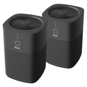 A pair of black Levoit air purifiers with a sleek, modern design featuring touch controls and ventilation grilles on top.