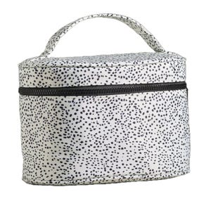 A cylindrical bag with a black speckled pattern on a white background, featuring a zipper and a handle on top.