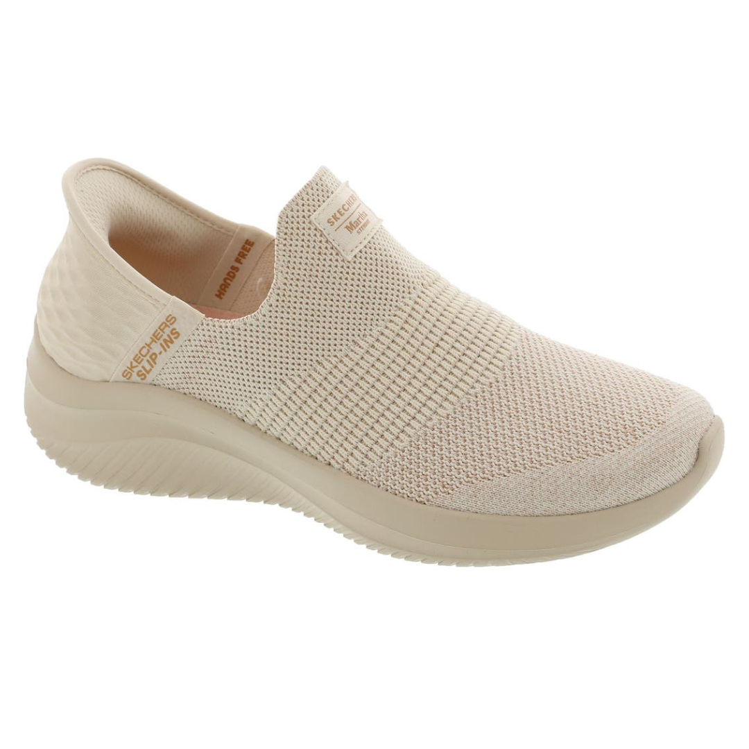 Beige slip-on sneaker with a knitted upper, featuring \“Skechers Slip-Ins\“ and \“Hands Free\“ labels on the side.