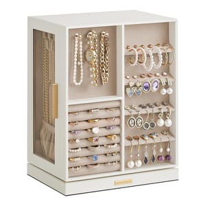 A white jewelry organizer features sections for hanging necklaces and bracelets, ring rolls, and slots for earrings and watches, with clear side panels for easy viewing.