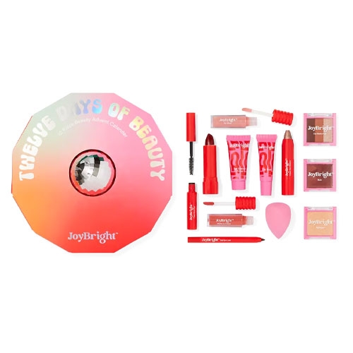 a round orange and pink box next to a variety of pink cosmetics
