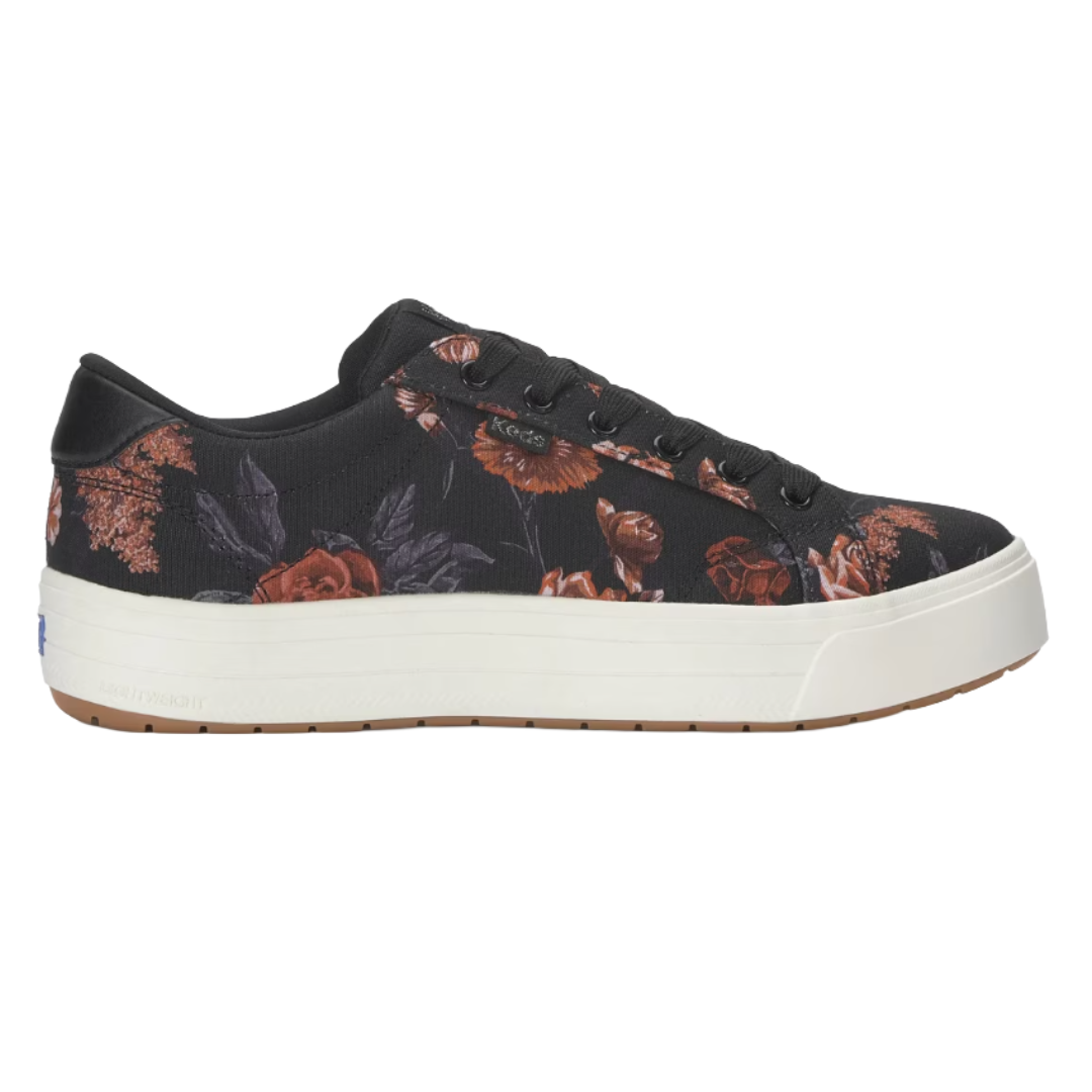 A black floral-patterned sneaker with a white platform sole and black laces.