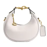 A round, white handbag with gold hardware, featuring a decorative \“C\“ charm and a tag with embossed lettering.