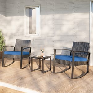 Outdoor patio set featuring two wicker rocking chairs with blue cushions and a matching square side table on a wooden deck.