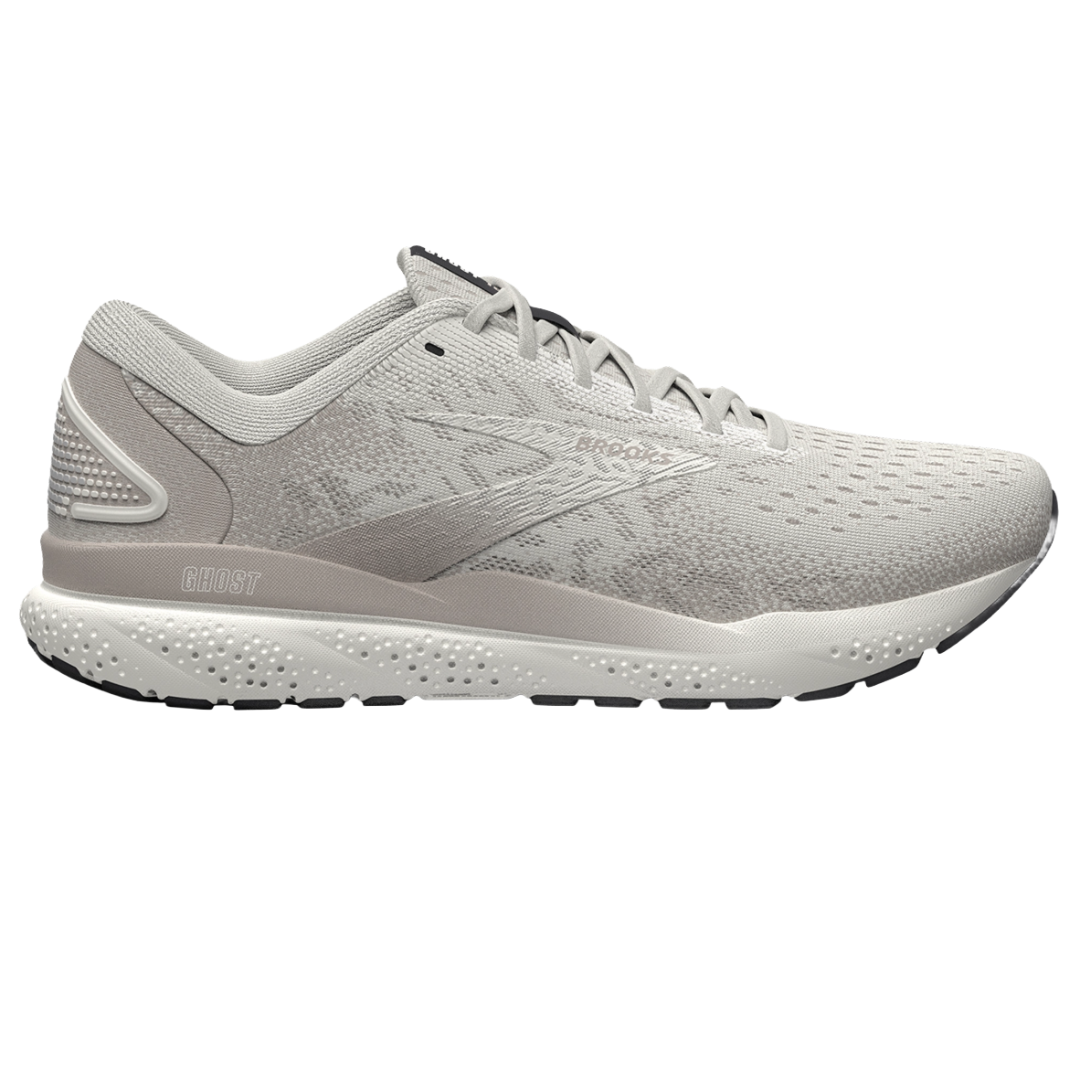 A light gray athletic shoe with a streamlined design, featuring the word \“Ghost\“ on the side and a speckled sole for traction.