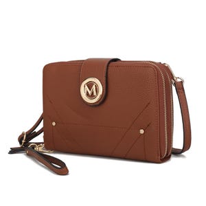 A brown textured crossbody wallet with a detachable strap, featuring a gold circular emblem with the letter \“M\“ on the front and a zippered compartment.