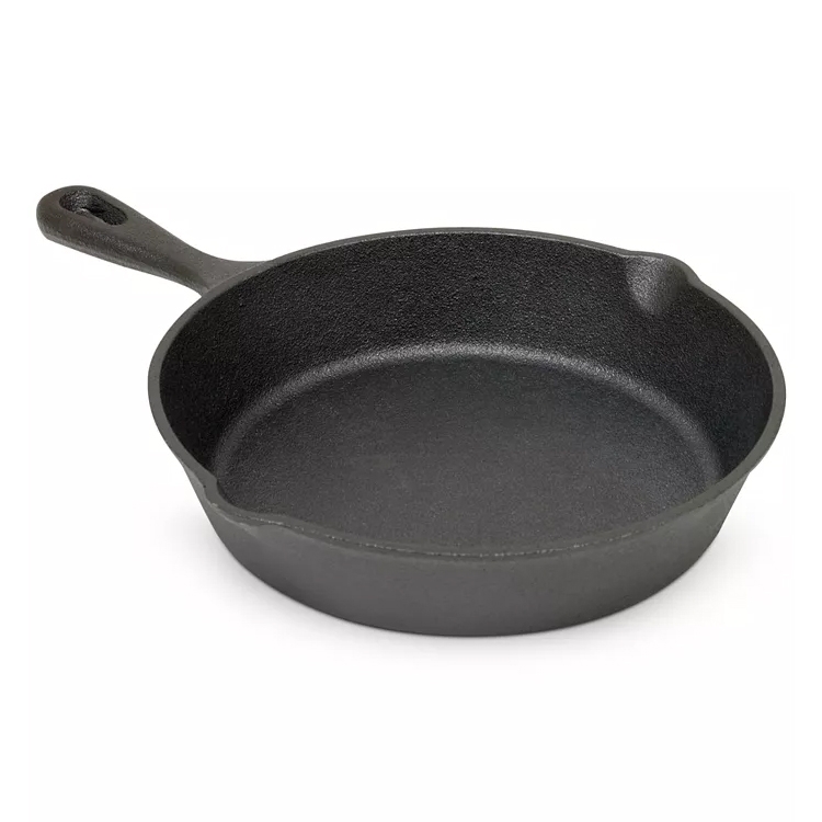 A black cast iron skillet with a single handle.