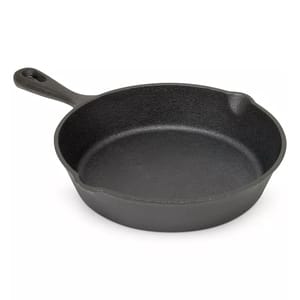 A black cast iron skillet with a single handle.