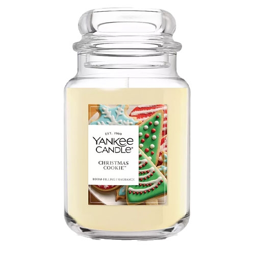 Yankee Candle \“Christmas Cookie\“ scented candle in a glass jar, featuring an image of decorated holiday cookies on the label.