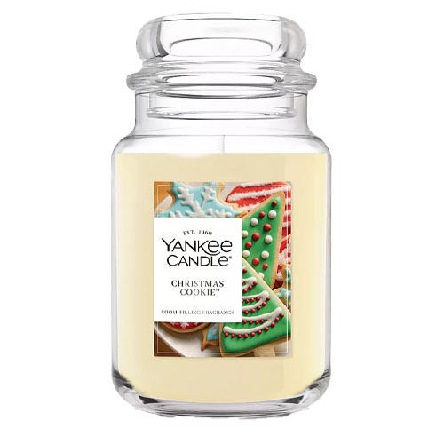 Yankee Candle \“Christmas Cookie\“ scented candle in a glass jar, featuring an image of decorated holiday cookies on the label.