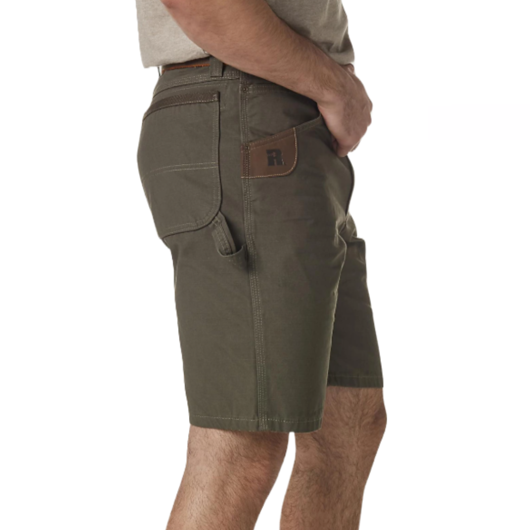 Wrangler Workwear Shorts are durable, knee-length shorts in olive green with reinforced pockets and a side utility loop, featuring a leather patch with a stylized \“R\“ logo.