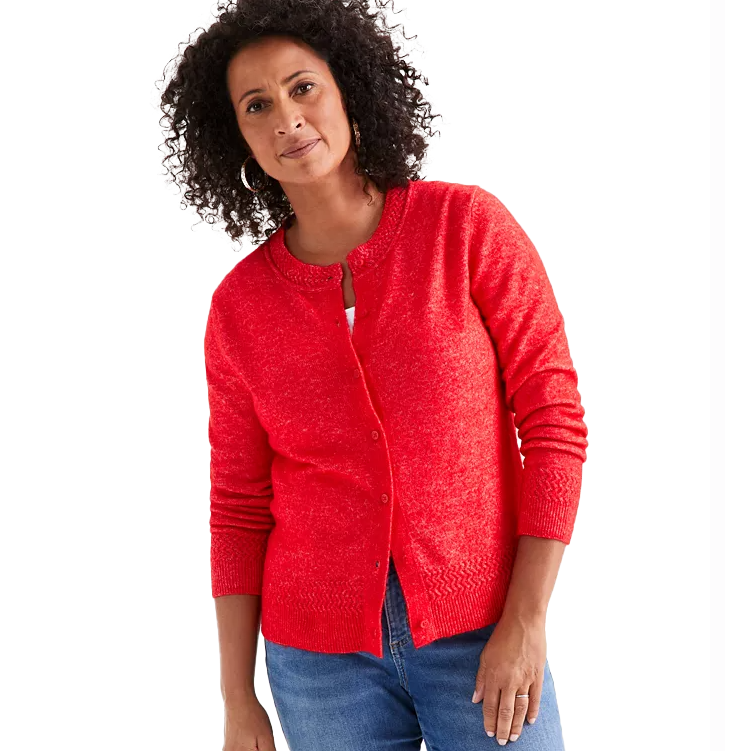 Red, long-sleeve cardigan, knit texture with a round neckline and button-down front. Paired with casual blue jeans.