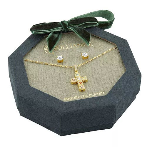 A jewelry set with a gold cross pendant necklace and matching stud earrings, displayed in an octagonal green box with a bow.