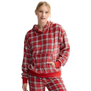 A person is wearing a red and white plaid hoodie with matching pants.