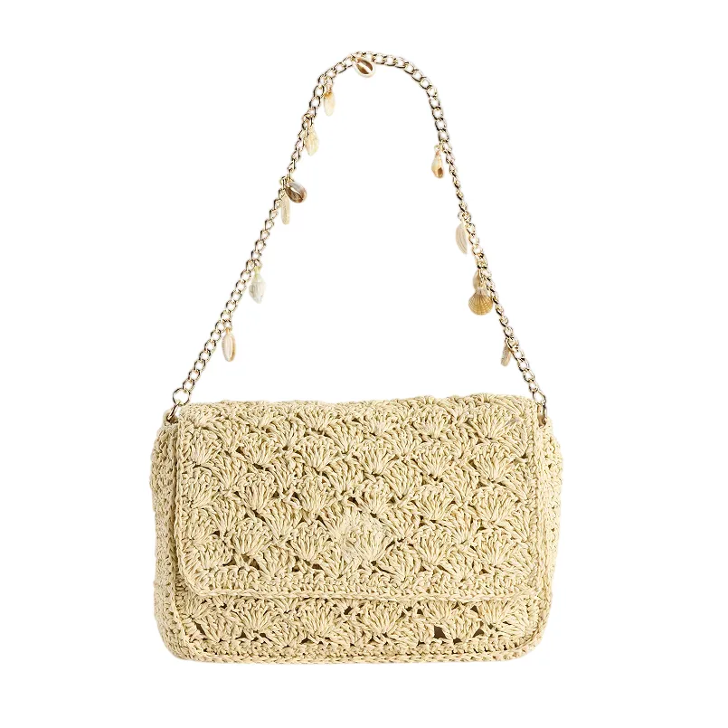 Beige crocheted shoulder bag with a gold chain strap adorned with small decorative charms.