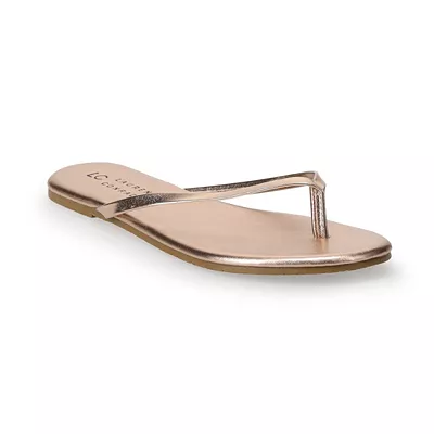 A pair of LC Lauren Conrad Honey 2 sandals in a metallic hue with a thong strap design and flat sole.
