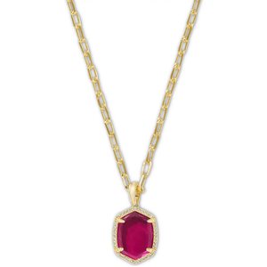 A Kendra Scott necklace featuring a gold link chain with a vibrant red pendant, set in a rectangular shape, surrounded by small clear stones.