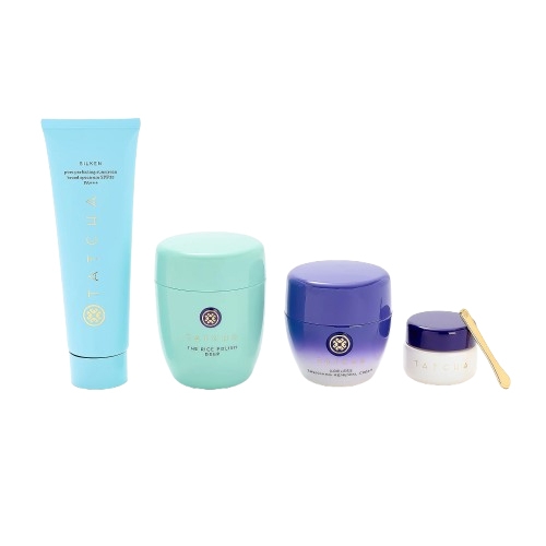 Tatcha 4pc Face & Eye Skin Care Set includes a light blue cleanser, a turquoise polish, a purple cream, and a small white jar with gold spatula, designed for comprehensive skin cleansing, exfoliation, and moisturizing.