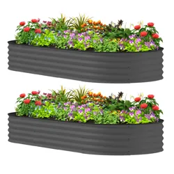 Two gray, corrugated metal raised garden beds filled with a variety of colorful flowers and greenery.