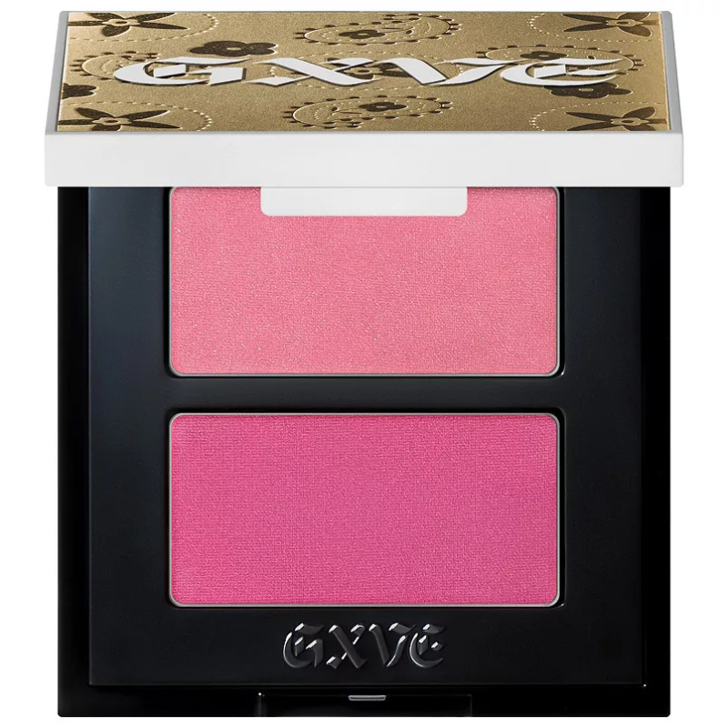 Gwen Stefani's blush duo features two shades of pink: a lighter, shimmery pink on top and a deeper matte pink below, housed in a compact with a decorative gold and black floral-patterned lid.