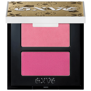 Gwen Stefani's blush duo features two shades of pink: a lighter, shimmery pink on top and a deeper matte pink below, housed in a compact with a decorative gold and black floral-patterned lid.