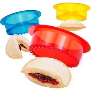 Set of colorful sandwich cutters designed to create sealed, crustless sandwiches. Includes red, blue, and yellow cutters.