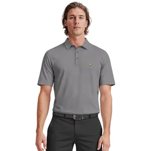 A man in a gray short-sleeve polo shirt with a small yellow bear logo on the chest, paired with black pants and a black belt.