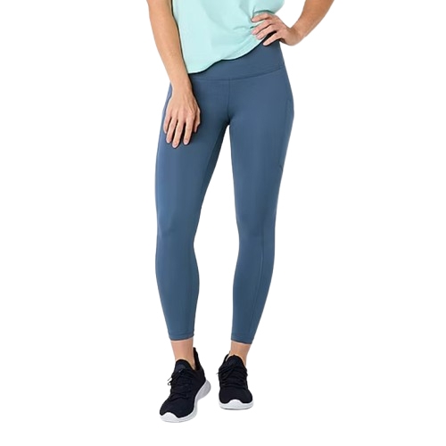 High rise ankle leggings in a blue color, paired with black sneakers. The leggings are full-length and sleek, designed for comfort and flexibility, featuring a wide waistband.