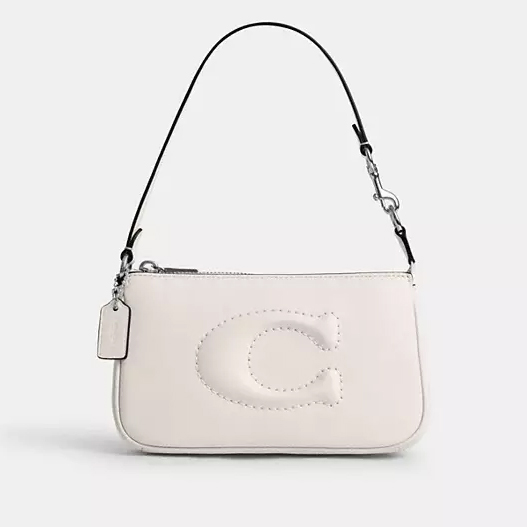 White shoulder bag with a prominent letter 'C' stitched on the front and a detachable metal chain strap.